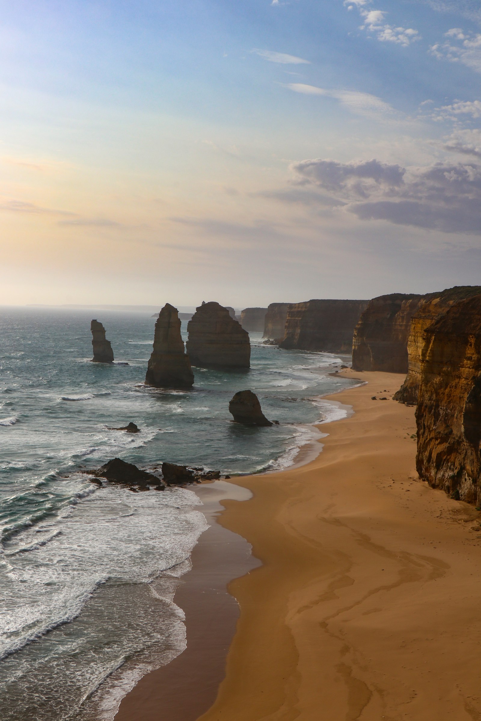 Limestone sea stacks along a wide Australian beach