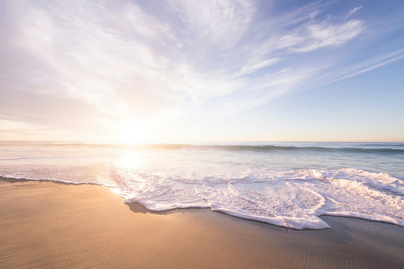 Morning light across wet sand